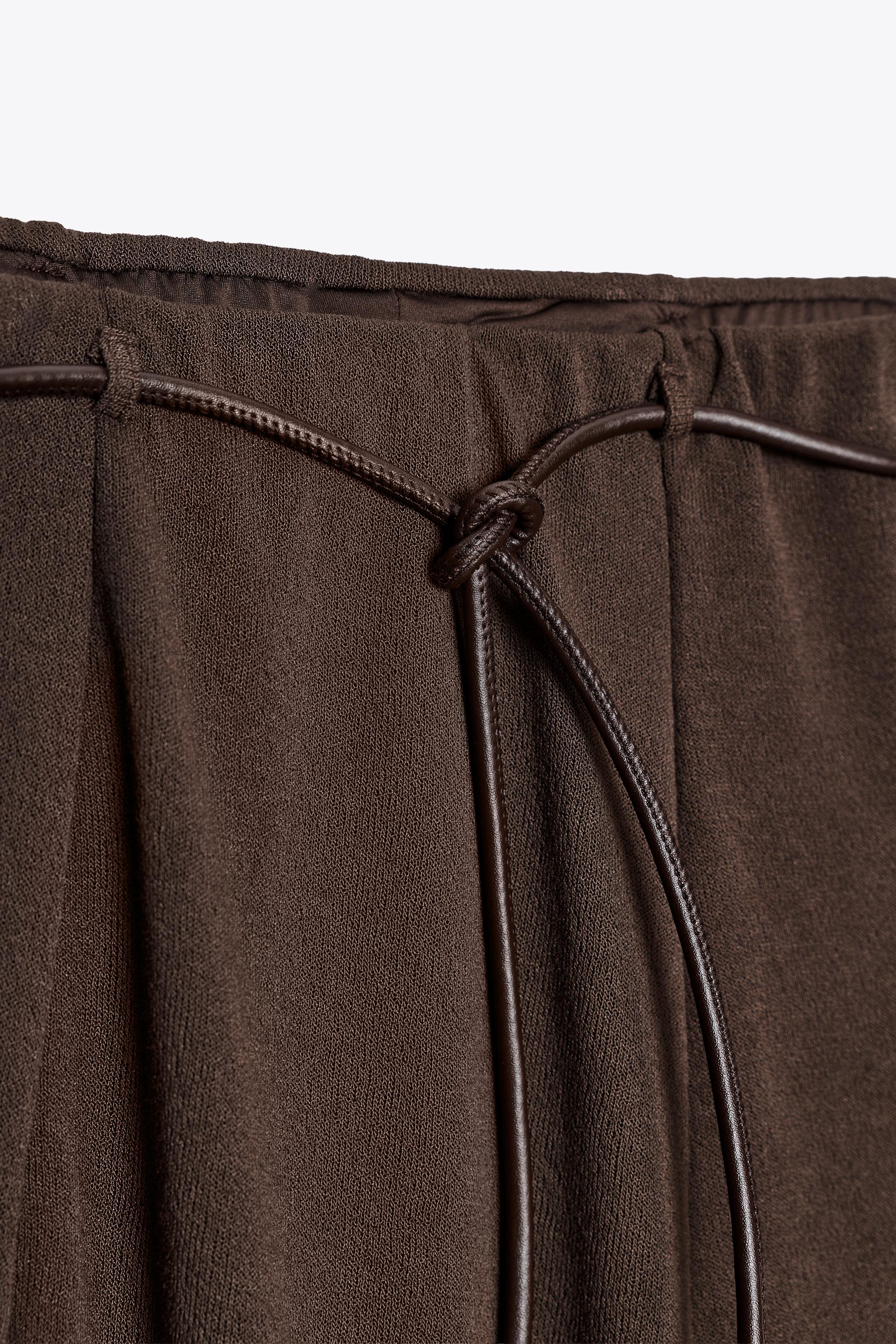 JUPE EN MAILLE COUPÉE CEINTURE